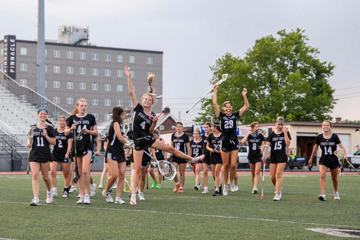 The Panthers celebrate the win while walking back to the bench after the whistle.