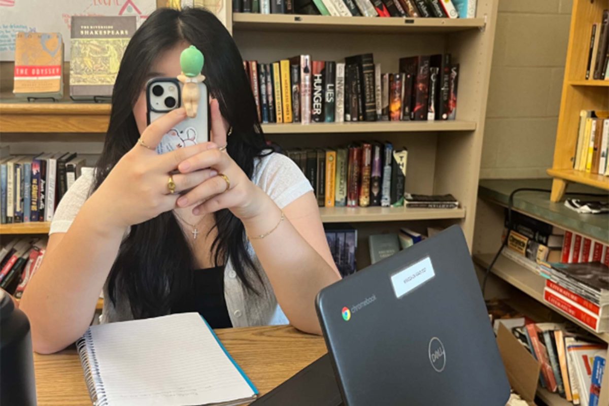 Caught between pages and pixels in the classroom, many students find themselves on their phone, procrastinating on school work.