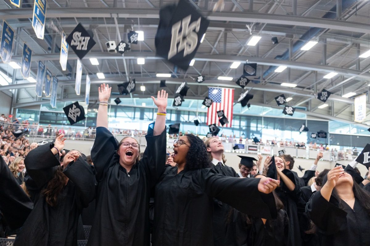 Seniors celebrate as they throw their caps into the air during the Class of 2025 Commencement at the Mirenda Center on June 6.