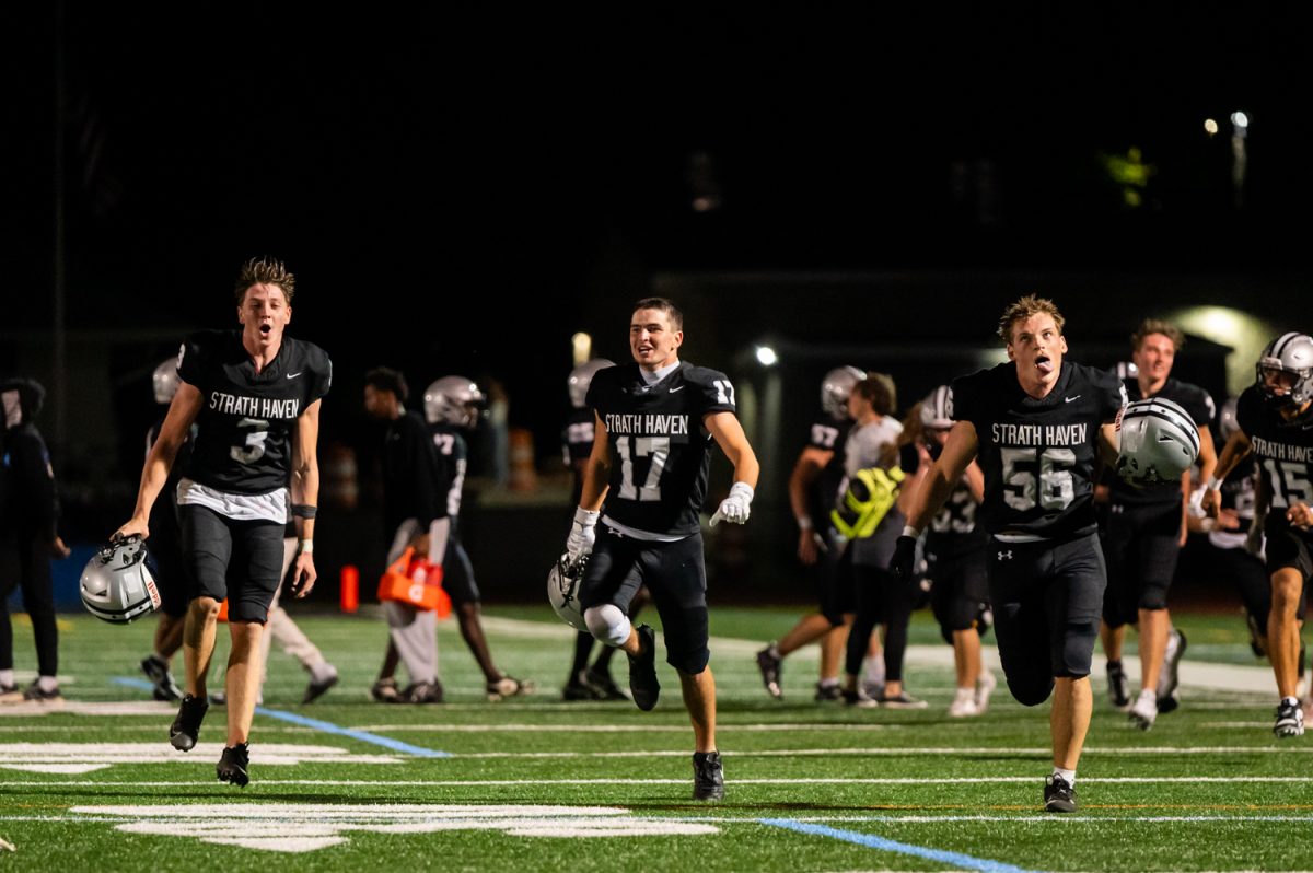 Landon Barlow (11), Quinn Kell (12), and Nick Farabaugh (12) run in celebrate the 44-7 victory against the Interboro Bucs on Friday, August 22. 