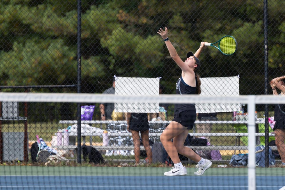Lexi Glass (9) prepares a serve against her Marple Newtown opponent on September 18 during the girls varsity tennis match on senior night.
