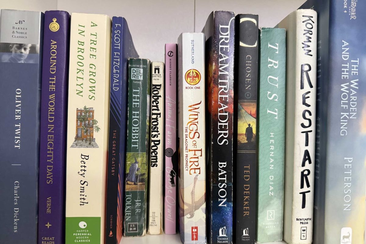  A variety of classics and modern books are displayed side by side on senior Giana Gliko's bookshelf.