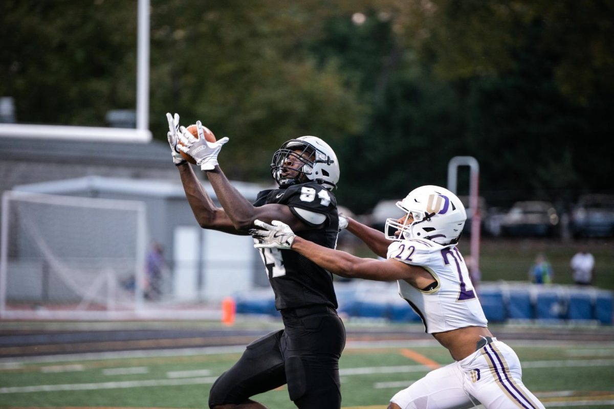 Tyler Slaughter (11) catches a 44 yard pass from Luke Mulhern (12) during a game against Upper Darby on September 5. The catch setup a goal line touchdown for Mulhern in the following plays. 