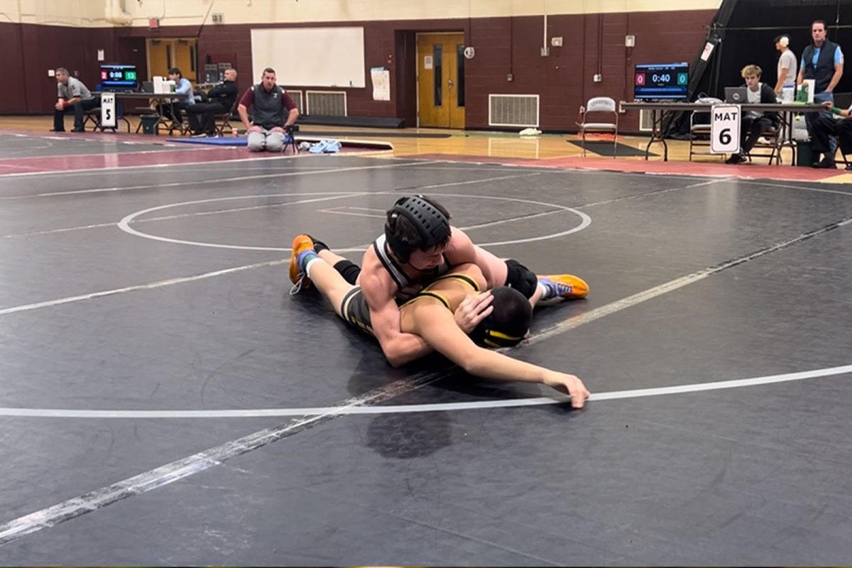 Shane Burger pins a wrestling opponent at a meet during the 2024-2025 wrestling season. Provided by Shane Burger.