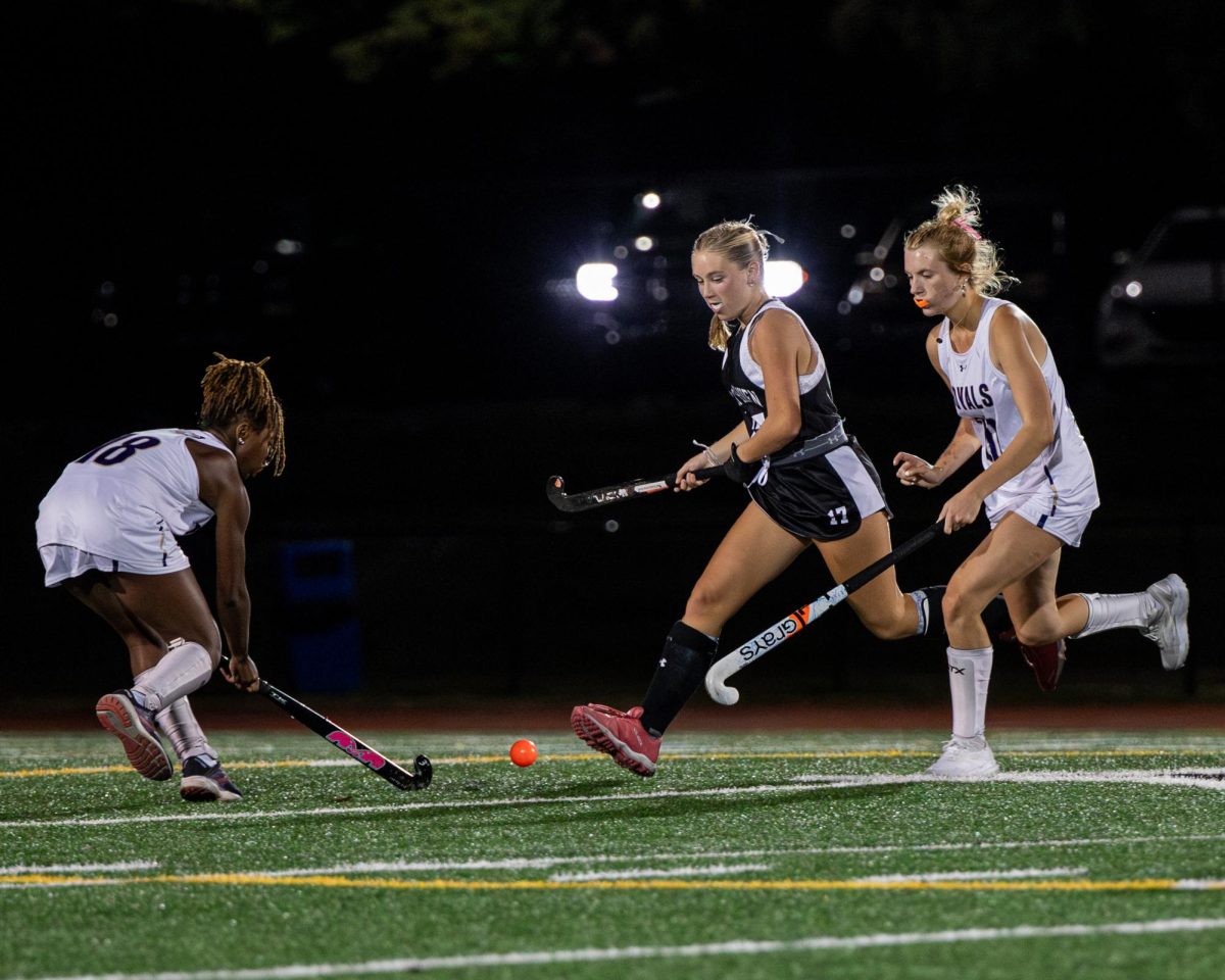 Lea Strauss (10) races to the ball as two Upper Darby defenders close in on October 14.  