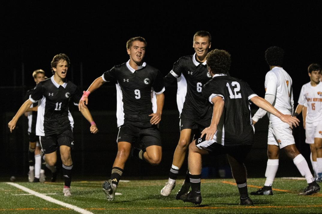 The team celebrates a goal from John O’Rourke (11), #9, during a game against the Marple Newtown Tigers on October 7. 
