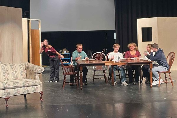 Cast members work through a scene during rehearsal on October 28. 