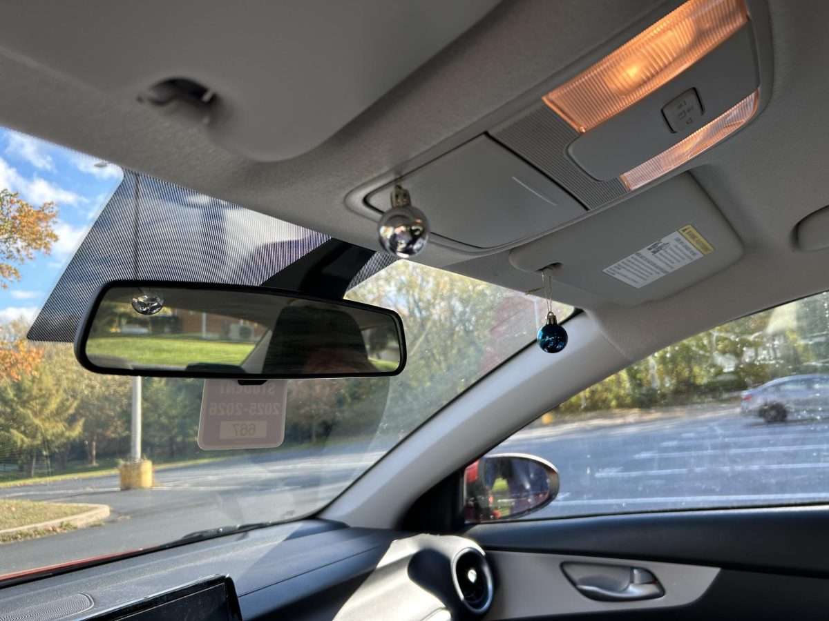 Two shiny ornaments hang above the console inside the Kia. "I got them from my work and they've been hanging up for almost two years," Santore said.