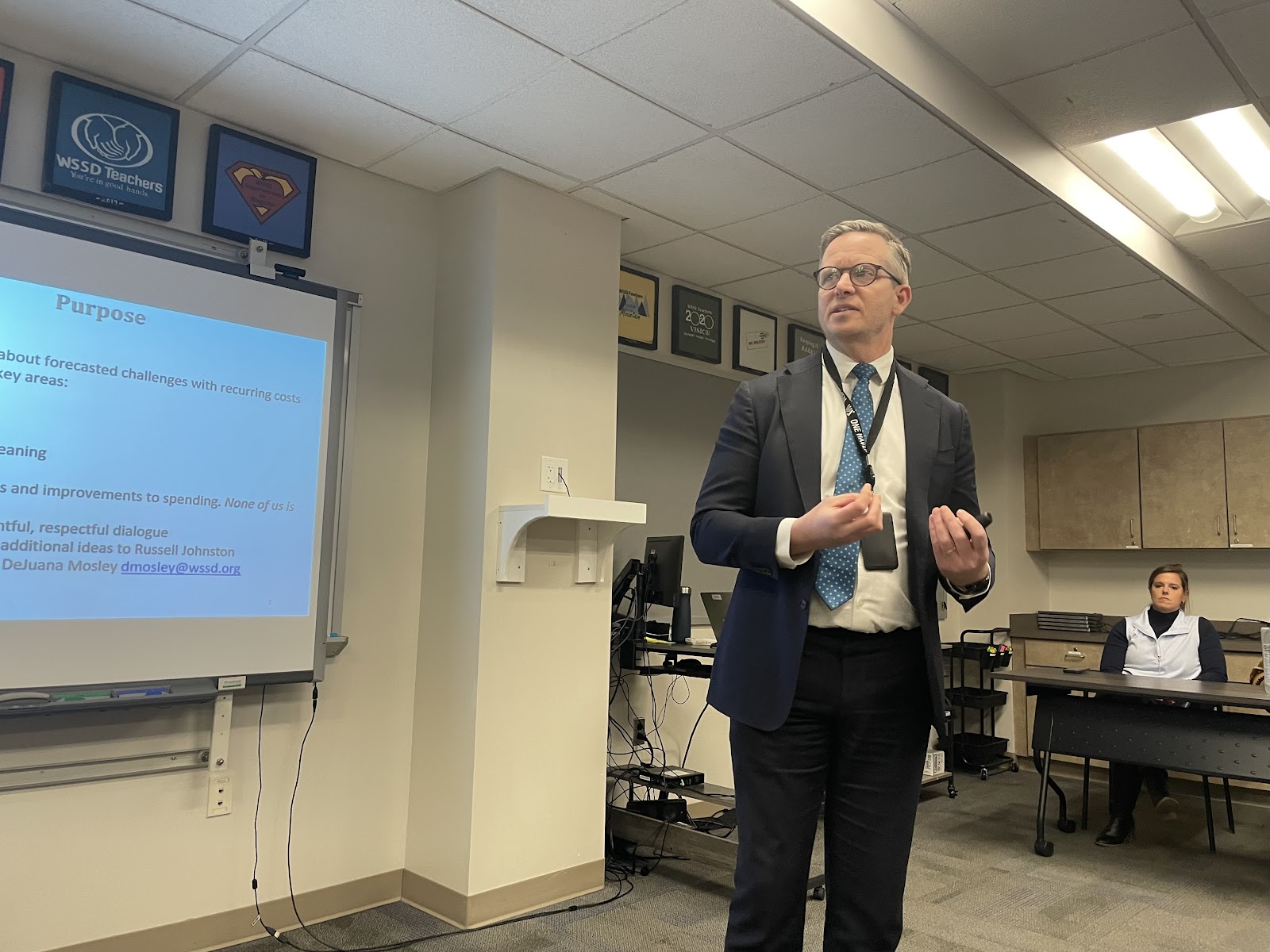 Dr. Russell Johnston presents at the December 8 community forum on the fiscal challenges the district is facing. Community members provided feedback for the district on potential budget cuts and solutions in five different areas: staffing, transportation, capital improvements, special education, and curriculum.