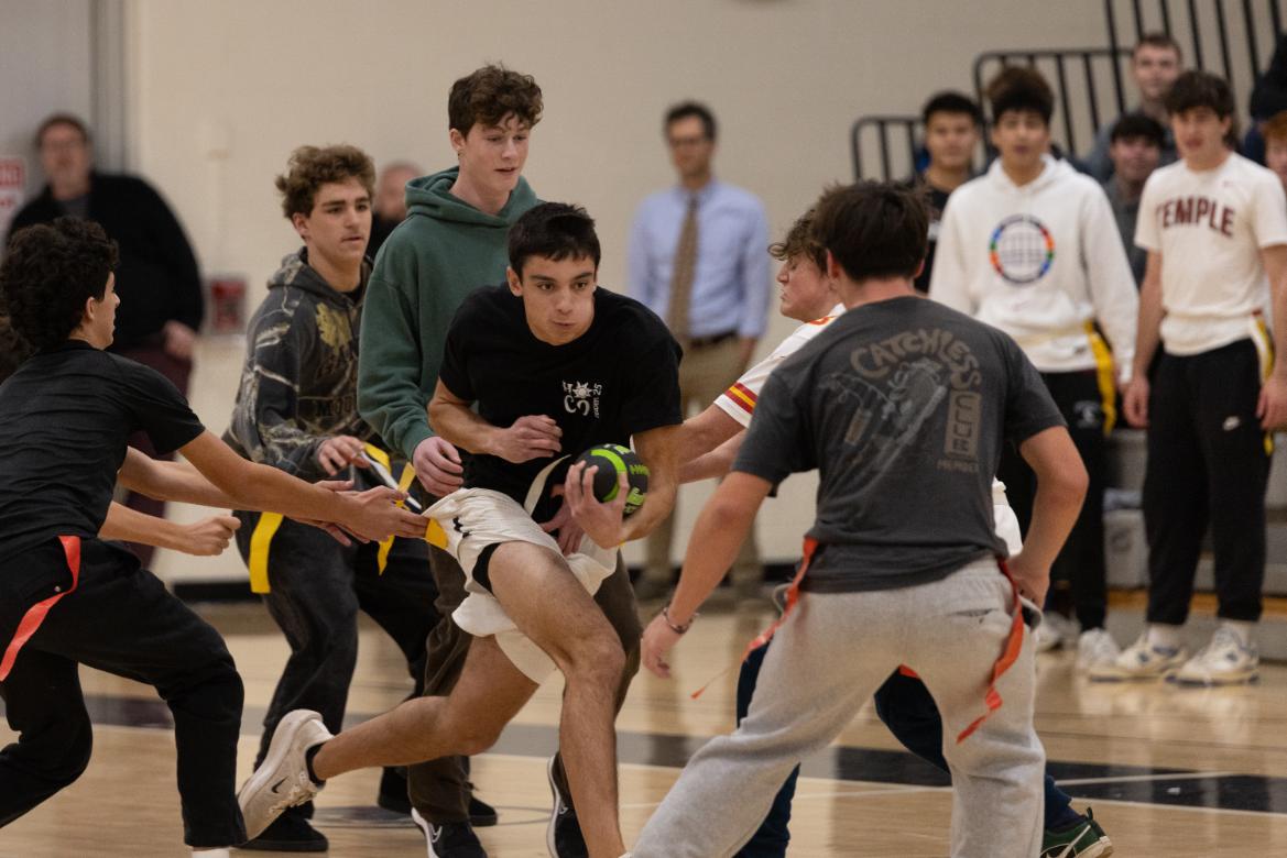Luke Mulhern (12) bursts through the freshmen team defense during the Turkey Bowl on November 25. 