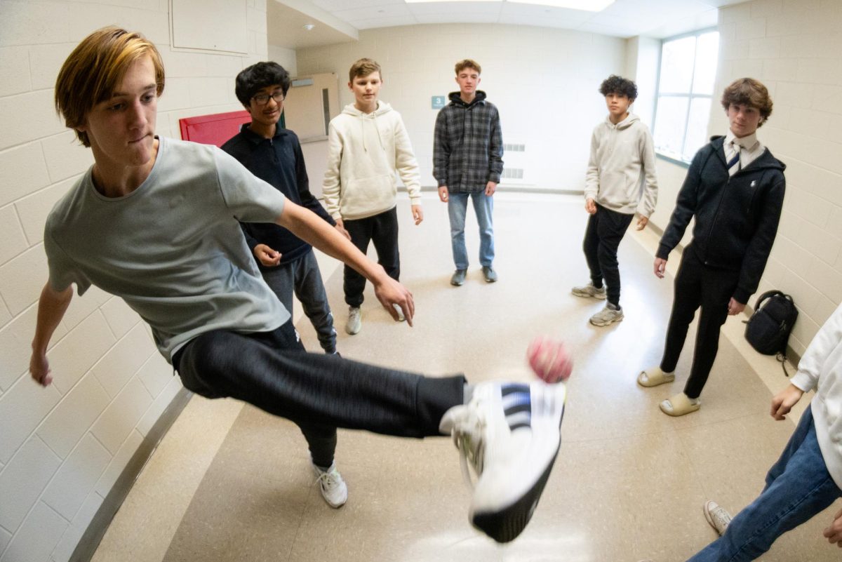 Sophomore Leo Dollé participates in a game of hacky sack on Thursday, December 11.