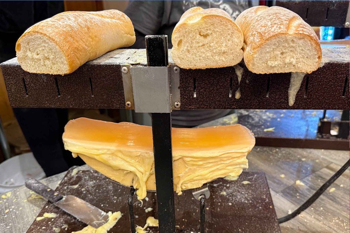 The Philadelphia Christmas Market displays raclette cheese. The cheese is melted and sandwiched between bread in this dish.