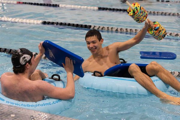 Aiden Taggart(12) and Andrew Waltman(12) play in the pool during the Rex-a-Thon swimming fundraiser on November 22 in the Strath Haven pool. After the main activities were all finished, the student athletes who participated in the fundraiser were allowed to play in the pool and chat with friends until the pool closed for the day. 