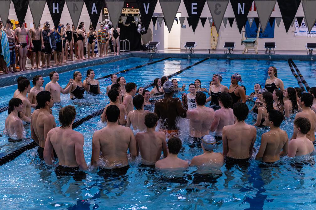 Members of the swim team gather for their spirit circle in the pool on senior night, Thursday, Jan. 22.