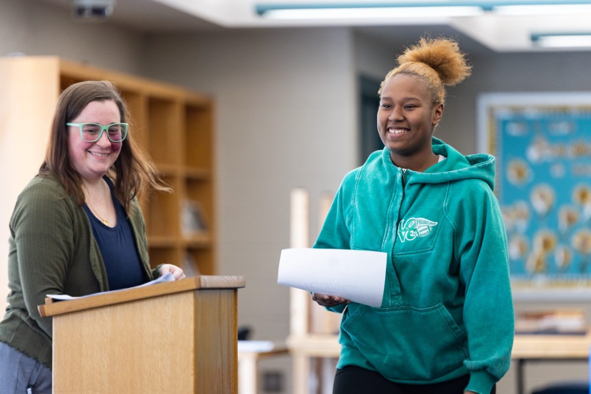 Serenity Johnson (10) smiles after receiving her certificate at the Q2 Panther Pride Ceremony on Thursday, Jan. 29 during fourth block in the library.