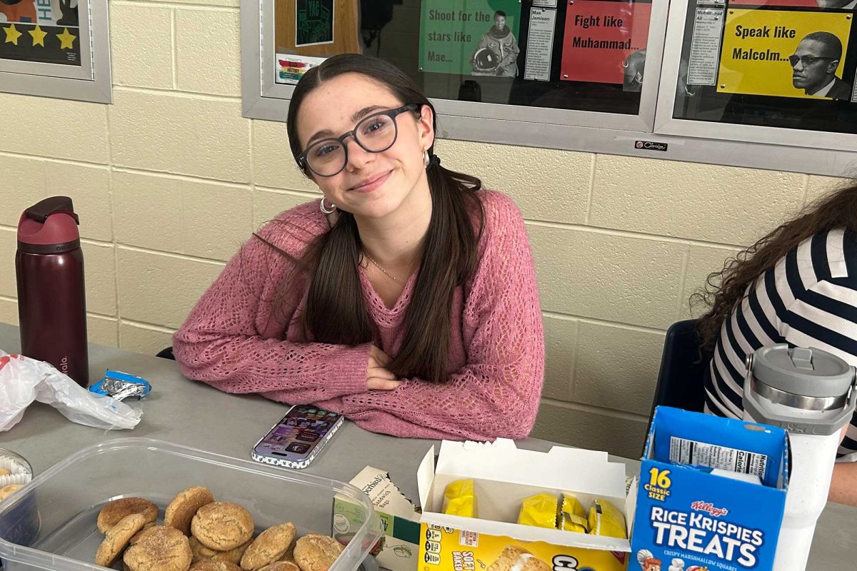 ASL Club President Roxanna Shelton (11) sells baked goods at the joint ASL Club and Foodie Friends bake sale on Feb. 2. 