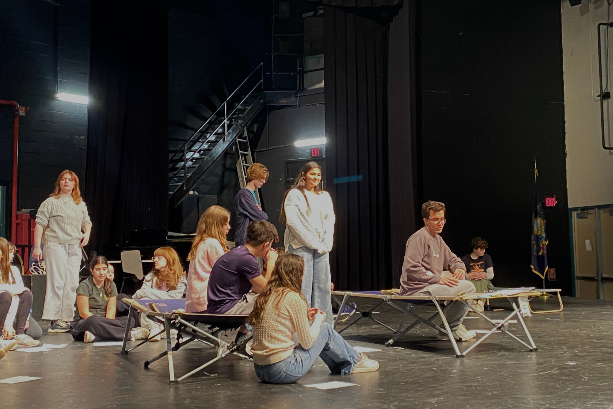 Students rehearse in the auditorium during after school hours, blocking scenes bit by bit.
