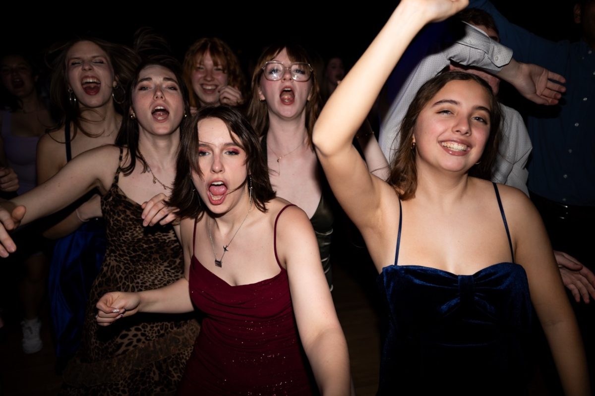 Scarlett Rein (10) and Asha Miller (10) dance along to the groovy beat spewing from the DJ’s speakers at the annual Frosh dance. The dance, held on March 20, included student guest appearances at the DJ booth