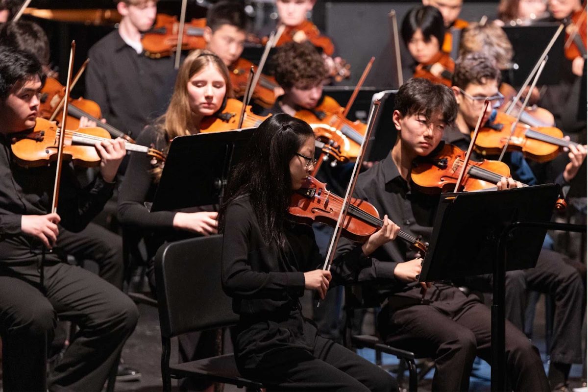George Slick Fellows junior Sophia Shao and sophomore Richard Kim lead the symphony orchestra as concertmaster and associate concertmaster respectively at the March 23 instrumental concert.