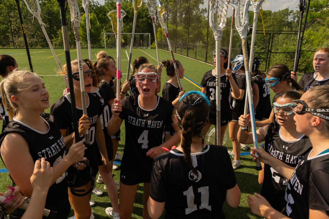 The girls varsity lacrosse team shouts during their pre-game huddle at their playoff game against Villa Maria Academy on May 19. The team lost 5-15, but the athletes had a lot of great saves and plays. "Coming off of a season losing a lot of valuable players, I think we really adjusted well, and we came together [and] did the best we could," Tessa Dignazio (10) said.