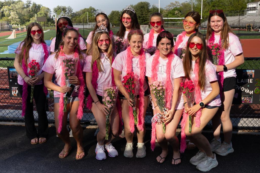 Seniors on the girls track team pose for a group photo during their senior night event on March 5 at King Field.