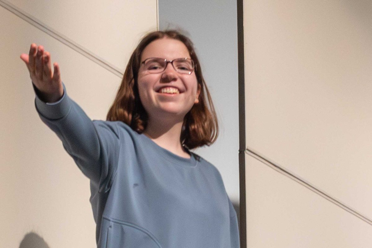 Katie Snyder (12) poses on stage in the auditorium.