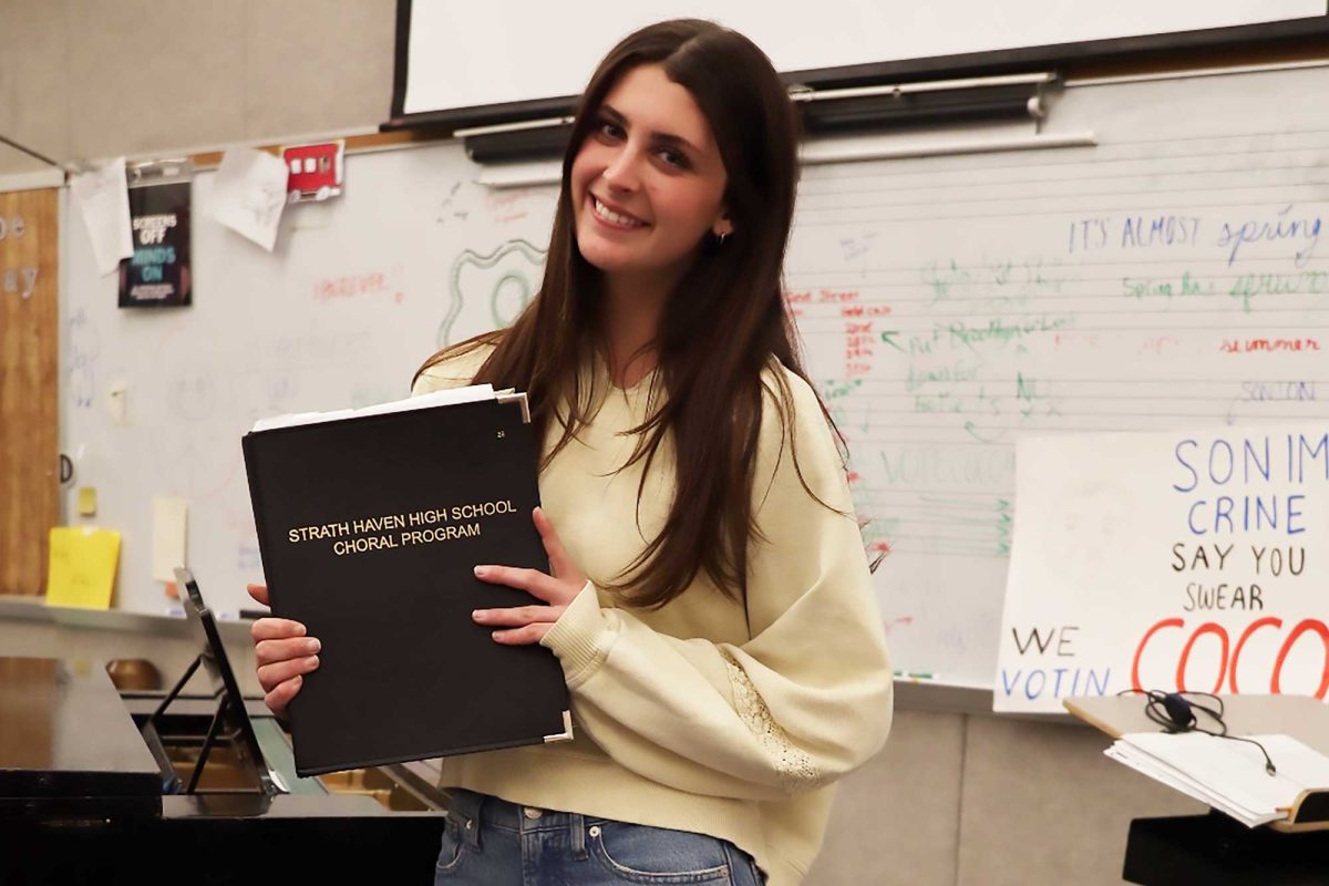 Lily Newport (12) poses in the choral music room.