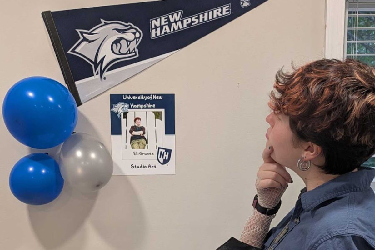 The reporter stands with their UNH setup at their graduation party on Saturday, May 9. Provided by Pearl Tweedy '26.