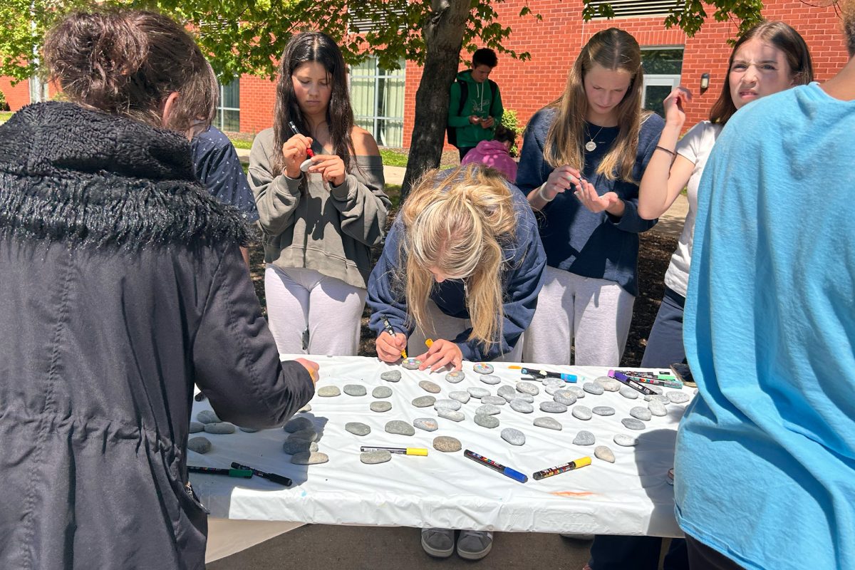 Students paint rocks during lunch on May 1, the beginning of Mental Health Awareness Month. The event was created five years ago to help spread creativity and kindness throughout the school community. "[The event lets] students showcase...anything that represents spreading positivity to their peers, to their friends, to themselves," behavioral health counselor and organizer of the event Ms. Marlena O'Kane said.