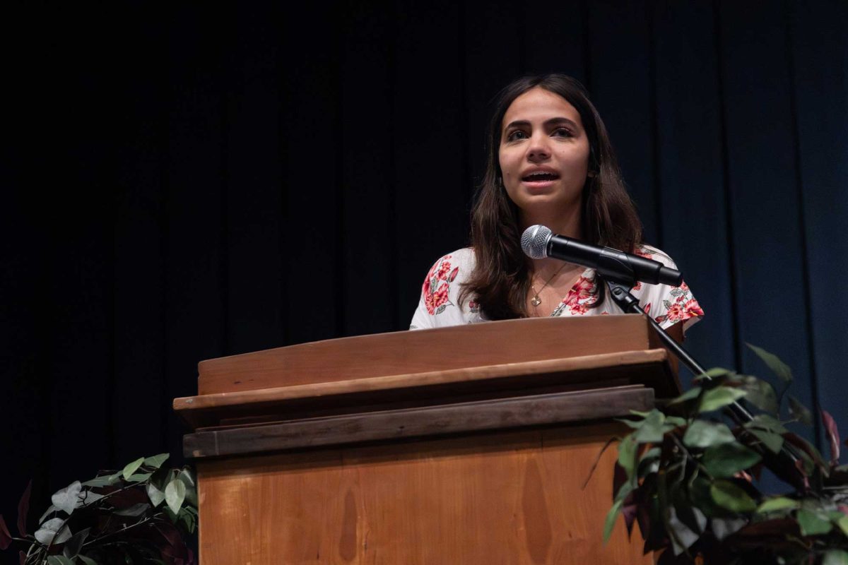 Maya Hartung (12) makes a speech in her officer role at the National Honor Society induction on Oct. 22.