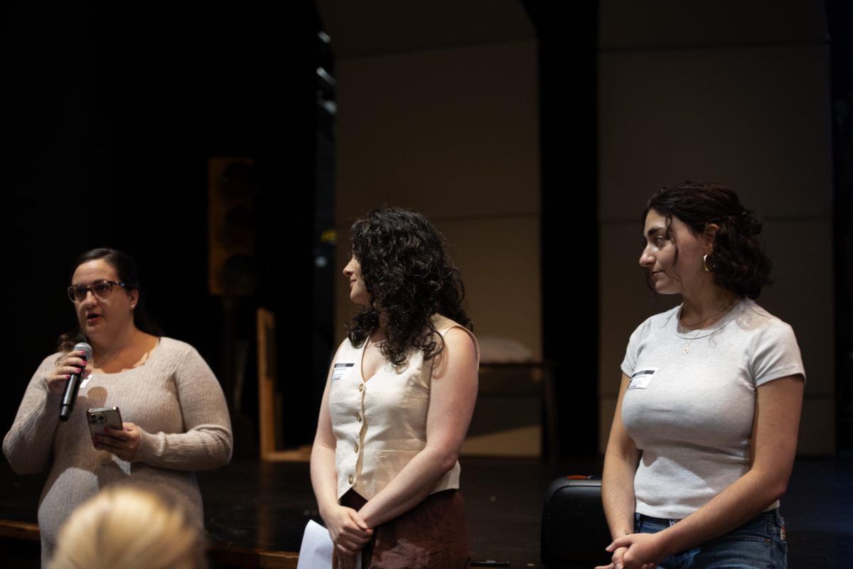 Victoria Perrone speaks at the senior assembly on Friday, May 29 as Deb Landau and Meredith Seidman watch.
