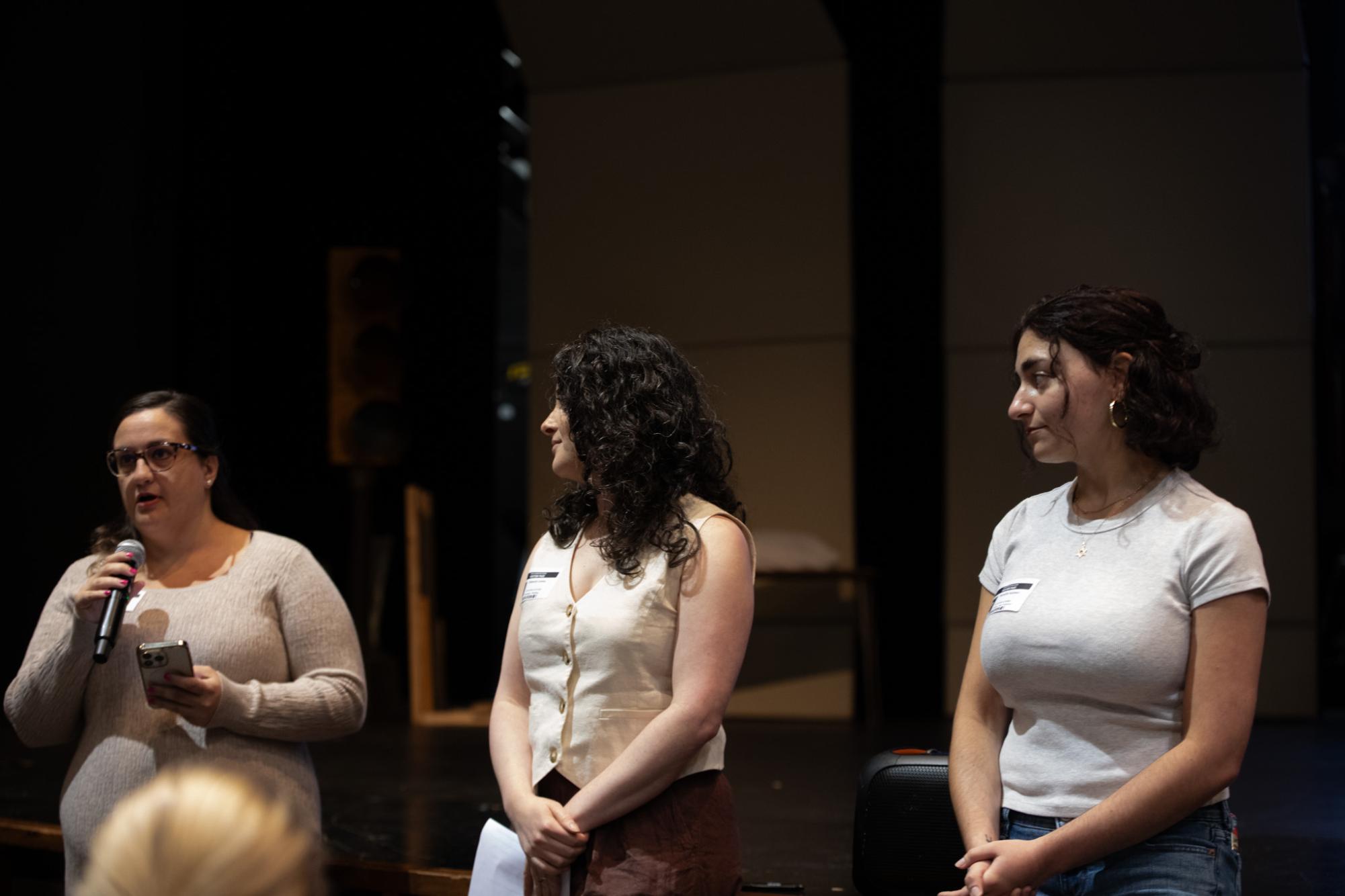 Victoria Perrone speaks at the senior assembly on Friday, May 29 as Deb Landau and Meredith Seidman watch.