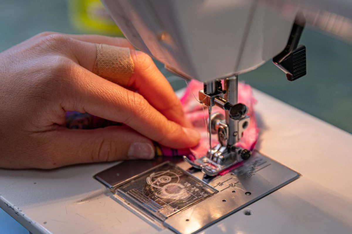 A student stitches on one of the classroom sewing machines during Clothing Design and Construction on June 9.
