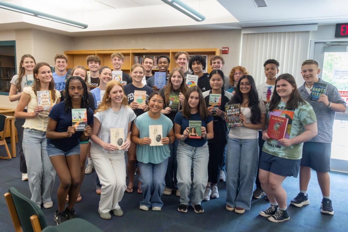 The Junior Book Award recipients pose with the books they won at the ceremony on May 26 in the library.