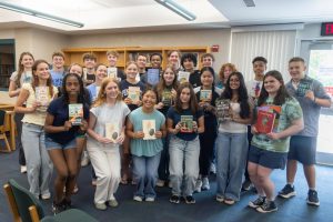 The Junior Book Award recipients pose with the books they won at the ceremony on May 26 in the library.