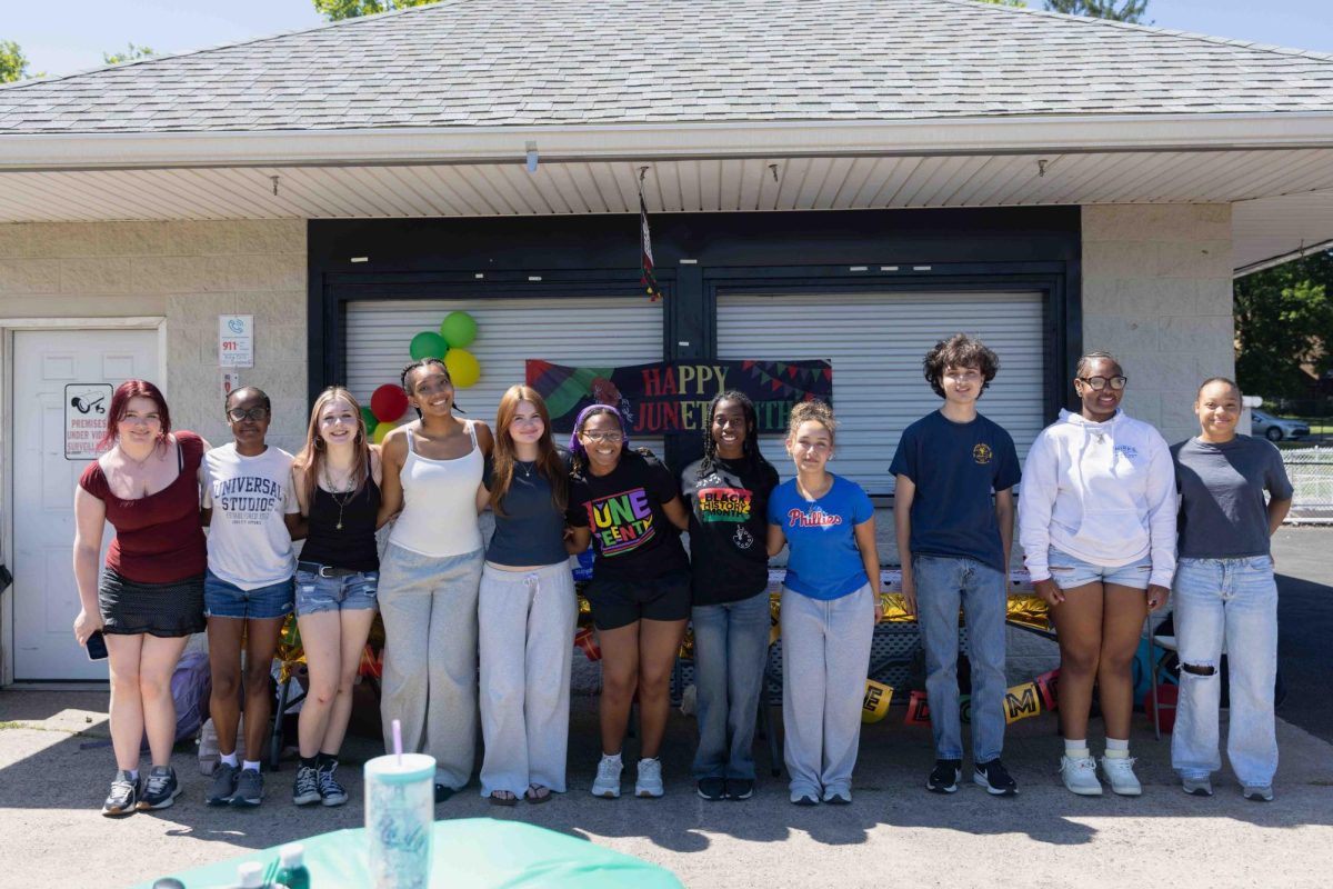 Members of the Young Activists Club and the Black Student Union pose for a group photo at the Juneteenth event on Wednesday, June 3.
