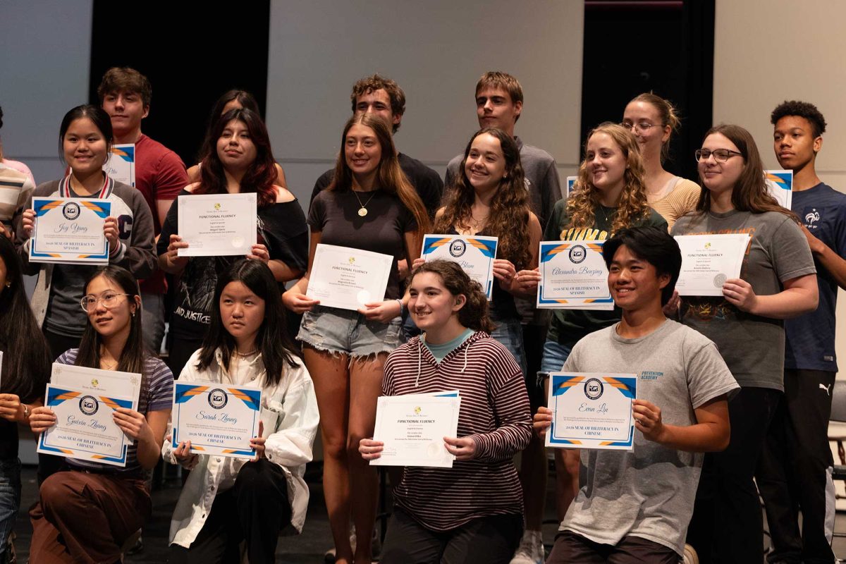 Students receive their certificates for the seals of biliteracy at the World Language Awards on Thursday, May 28.